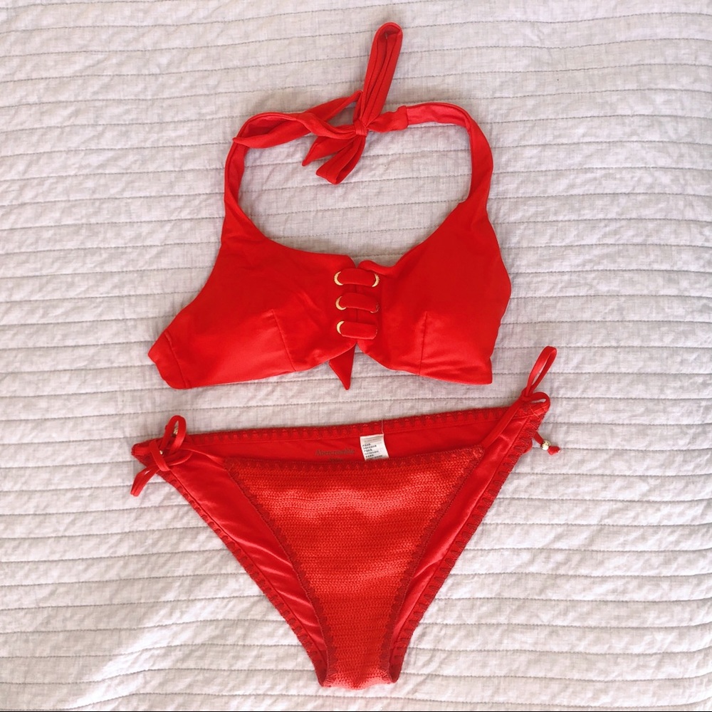 red bikini with knit bottoms and gold hardware